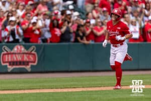 Nebraska Cornhusker Will Jesske (13) runs home after hitting a grand slam against the Iowa Hawkeyes in the third inning during a college baseball game on Saturday, May 9, 2026, in Lincoln, Neb. Photo by John S. Peterson.
