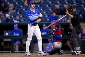 Creighton batter Teddy Deters tosses his bat after getting walked during a college baseball game against the Kansas Jayhawks on Tuesday, May 5, 2026, in Omaha, Nebraska. Photo by Braden Cochran.