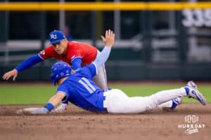 Creighton base runner Ben North (11) slides around a Kansas second baseman Cade Baldridge (9) to avoid the tag during a college baseball game against the Kansas Jayhawks on Tuesday, May 5, 2026, in Omaha, Nebraska. Photo by Braden Cochran.