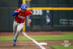 Kansas base runner Dylan Schlotterback (7) rounds third base on his way to home plate against the Crieghton Bluejays during a college baseball game on Tuesday, May 5, 2026, in Omaha, Nebraska. Photo by Braden Cochran.