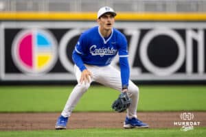 Creighton third baseman Rocco Gump (15) readily watches for the ball to be hit his way during a college baseball game against the Kansas Jayhawks on Tuesday, May 5, 2026, in Omaha, Nebraska. Photo by Braden Cochran.