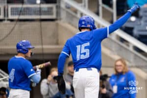 Creighton batter Rocco Gump points to the crowd after scoring for the Bluejays during a college baseball game against the Kansas Jayhawks on Tuesday, May 5, 2026, in Omaha, Nebraska. Photo by Braden Cochran.