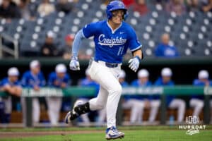 Creighton baserunner Ben North (11) sprints down the first baseline after a base hit during a college baseball game against the Kansas Jayhawks on Tuesday, May 5, 2026, in Omaha, Nebraska. Photo by Braden Cochran.