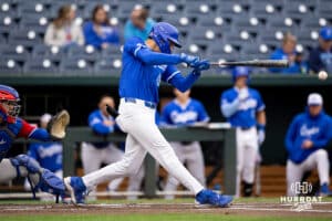 Creighton Bluejay batter Rocco Gump (15) makes contact with the ball for a line drive in the bottom of the first inning during a college baseball game against the Kansas Jayhawks on Tuesday, May 5, 2026, in Omaha, Nebraska. Photo by Braden Cochran.