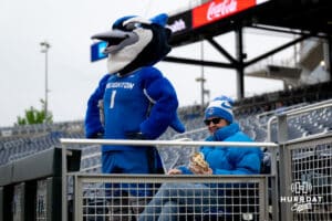 Creighton mascot Billy the Bluejay stands next to a fan before the baseball game against the Kansas Jayhawks starts on Tuesday, May 5, 2026, in Omaha, Nebraska. Photo by Braden Cochran.