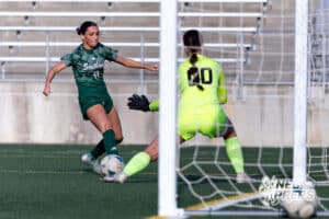 Lincoln Southwest Bella Hertzel (11) on the attack against Columbus Odalys Molina-Aguilar (00) in the second half during a high school soccer match on Wednesday, May 6, 2026, in Lincoln, Neb. Photo by John S. Peterson.