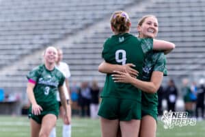 Lincoln Southwest Ansley Throener (9) celebrate hugging a teammate against Columbus in the first half during a high school soccer match on Wednesday, May 6, 2026, in Lincoln, Neb. Photo by John S. Peterson.