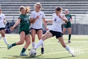 Lincoln Southwest Tea Tweten (19) kicks the ball against Columbus Josie Larsen (2) in the first half during a high school soccer match on Wednesday, May 6, 2026, in Lincoln, Neb. Photo by John S. Peterson.