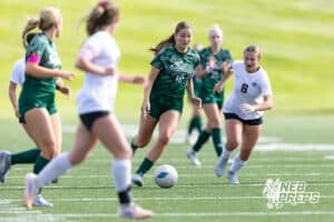 Lincoln Southwest Sam Penner (18) dribbles the ball against Columbus in the first half during a high school soccer match on Wednesday, May 6, 2026, in Lincoln, Neb. Photo by John S. Peterson.