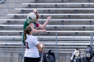 Lincoln Southwest Ansley Throener (9) heads the ball against Columbus Elena Moseman (11) in the first half during a high school soccer match on Wednesday, May 6, 2026, in Lincoln, Neb. Photo by John S. Peterson.