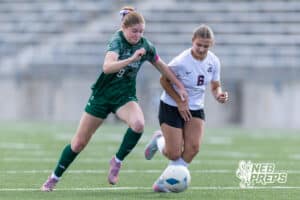 Lincoln Southwest Ansley Throener (9) dribbles the ball against Columbus Karsyn Jaeger (6) in the first half during a high school soccer match on Wednesday, May 6, 2026, in Lincoln, Neb. Photo by John S. Peterson.