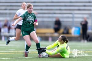 Lincoln Southwest Ansley Throener (9) on the attack against Columbus Odalys Molina-Aguilar (00) in the first half during a high school soccer match on Wednesday, May 6, 2026, in Lincoln, Neb. Photo by John S. Peterson.