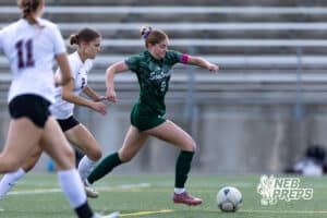 Lincoln Southwest Ansley Throener (9) dribbles the ball against Columbus Josie Larsen (2) in the first half during a high school soccer match on Wednesday, May 6, 2026, in Lincoln, Neb. Photo by John S. Peterson.