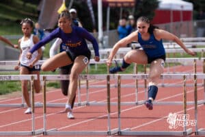 Bellevue Wests Janiyah Willis and Papillion LaVista Souths Fiona Thorne compete in the girls 100 hurdles during the Metro Conference T&F Meet on May 6, 2026, in Omaha, Nebraska. Photo by Brandon Tiedemann.