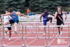 Ethan Laux jumps over a hurdle during the Metro Conference T&F Meet on May 6, 2026, in Omaha, Nebraska. Photo by Brandon Tiedemann.
