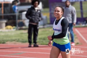 Aliyah Perry smiles after winning the girls 100m during the Metro Conference T&F Meet on May 6, 2026, in Omaha, Nebraska. Photo by Brandon Tiedemann.