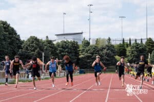 Dallas Davison crosses the finish line in the boys 100m during the Metro Conference T&F Meet on May 6, 2026, in Omaha, Nebraska. Photo by Brandon Tiedemann.
