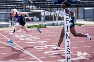 Runners cross the finish line in the girls 300m hurdles during the Metro Conference T&F Meet on May 6, 2026, in Omaha, Nebraska. Photo by Brandon Tiedemann.