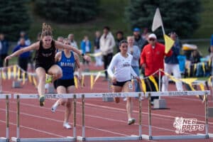 Layla Phillps jumps over a hurdle during the Metro Conference T&F Meet on May 6, 2026, in Omaha, Nebraska. Photo by Brandon Tiedemann.