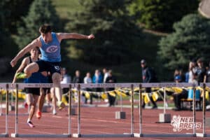 Ethan Laux jumps over a hurdle during the Metro Conference T&F Meet on May 6, 2026, in Omaha, Nebraska. Photo by Brandon Tiedemann.