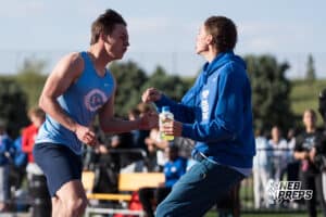 Silas Bush celebrates with a teammate after winning the boys 200m finals during the Metro Conference T&F Meet on May 6, 2026, in Omaha, Nebraska. Photo by Brandon Tiedemann.