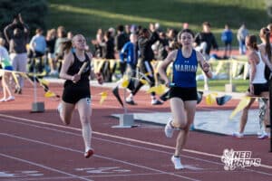 Mabel Henningsen crosses the finish line during the Metro Conference T&F Meet on May 6, 2026, in Omaha, Nebraska. Photo by Brandon Tiedemann.