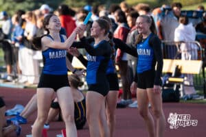 Omaha Marian celebrates winning the girls 4x400m during the Metro Conference T&F Meet on May 6, 2026, in Omaha, Nebraska. Photo by Brandon Tiedemann.