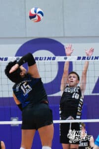 Lincoln South’s Nickolas Cubas (15) hitting a volleyball towards Burke's Micah McCarty (10) during a Nebraska boys volleyball state championship game against Burke on Sunday, May 3, 2026, in Bellevue, Neb. Photo by Jandi Green.