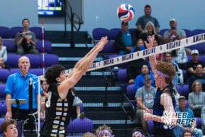 Burke's Holden Kutash (18) blocking a volleyball during a Nebraska boys volleyball state championship game against Lincoln South on Sunday, May 3, 2026, in Bellevue, Neb. Photo by Jandi Green.