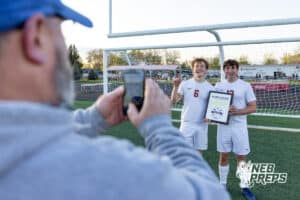 Roncalli’s Ehren Stoffel (6) and Jack Stoffel (12) are getting their picture taken after winning the River Cities Conference Championship against South Sioux City on Thursday, April 30, 2026 in South Sioux City, Nebraska. Photo by Jack Stephens.