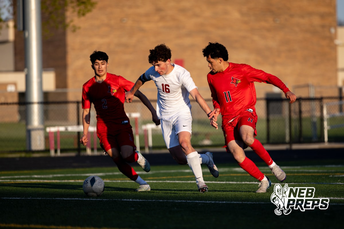 Roncalli’s Will Preston (16) is dribbling the ball while being double teamed during a high school soccer game against South Sioux City on Thursday, April 30, 2026 in South Sioux City, Nebraska. Photo by Jack Stephens.