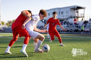Roncalli’s Will Preston (16) is attempting to dribble the ball past a defender during a high school soccer game against South Sioux City on Thursday, April 30, 2026 in South Sioux City, Nebraska. Photo by Jack Stephens.