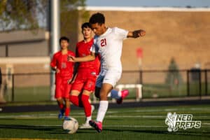 Roncalli’s Jordan Martinez (21) is kicking the ball into the goal during a high school soccer game against South Sioux City on Thursday, April 30, 2026 in South Sioux City, Nebraska. Photo by Jack Stephens.