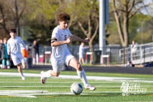 Roncalli’s Will Preston (16) is dribbling the ball downfield during a high school soccer game against South Sioux City on Thursday, April 30, 2026 in South Sioux City, Nebraska. Photo by Jack Stephens.