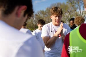 Roncalli’s Asher Hanson (18) is leading the team in a pregame prayer before a high school soccer game against South Sioux City on Thursday, April 30, 2026 in South Sioux City, Nebraska. Photo by Jack Stephens.