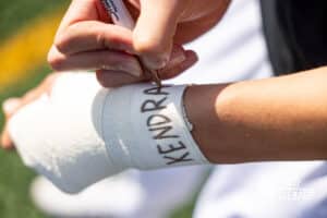 Roncalli Senior Sebastian Camio (5) is honoring his mother, Kendra Camio, by writing her name on his wrist tape before a high school soccer game against South Sioux City on Thursday, April 30, 2026 in South Sioux City, Nebraska. Photo by Jack Stephens.