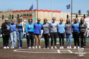 Creighton alumni pose for a photo on Alumni Night before the Creighton Bluejays take on the DePaul Blue Demons in a college softball game on Saturday, May 2, 2026, in Omaha, NE. Photo by Jandi Green.