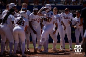 Texas Longhorn infielder Jaycie Nichols (24) runs home after being hit in by Katie Stewart three run home run in the sixth inning during the WCWS elimination game on Sunday, May 31, 2026, in Oklahoma City. Photo by John S. Peterson.