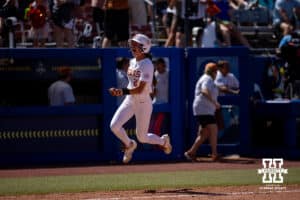 Texas Longhorn infielder Jaycie Nichols (24) runs home after being hit in by Katie Stewart three run home run in the sixth inning during the WCWS elimination game on Sunday, May 31, 2026, in Oklahoma City. Photo by John S. Peterson.