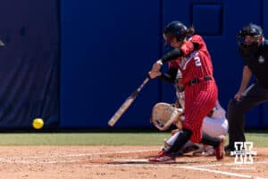 Nebraska Cornhusker Lauren Camenzind (2) hits a single in the fifth inning against the Texas Longhorns during the WCWS elimination game on Sunday, May 31, 2026, in Oklahoma City. Photo by John S. Peterson.