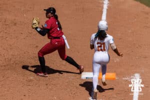 Nebraska Cornhusker infielder Bella Bacon (3) forces out Texas Longhorn outfielder Kayden Henry (21) in the fourth inning during the WCWS elimination game on Sunday, May 31, 2026, in Oklahoma City. Photo by John S. Peterson.