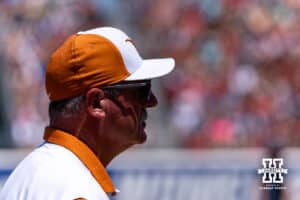 Texas Longhorn head coach Mike White watches the action on the diamond against the Nebraska Cornhuskers in the first inning during the WCWS elimination game on Sunday, May 31, 2026, in Oklahoma City. Photo by John S. Peterson.