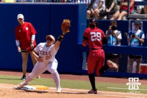 Texas Longhorn utility Katie Stewart (20) forces out Nebraska Cornhusker infielder Samantha Bland (29) in the second inning during the WCWS elimination game on Sunday, May 31, 2026, in Oklahoma City. Photo by John S. Peterson.