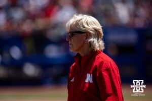 Nebraska Cornhusker head coach Rhonda Revelle watching the action on the field against the Texas Longhorns in the first inning during the WCWS elimination game on Sunday, May 31, 2026, in Oklahoma City. Photo by John S. Peterson.
