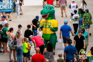 Runza Rex hanging around fans during a Storm Chasers game on Saturday, May 30, 2026, in Omaha, Neb. Photo by Jandi Green.