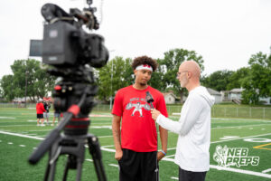 Millard South’s Trae Taylor interviewed by Mike Sautter during a football practice Thursday, June 4, 2026, in Omaha, Nebraska. Photo by Christian Naujokaitis.