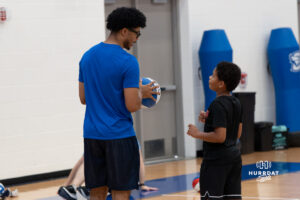 Creighton Bluejay Austin Swartz talks with a camper during their yearly abilities camp on June 5, 2026, in Omaha, Nebraska. Photo by Brandon Tiedemann.