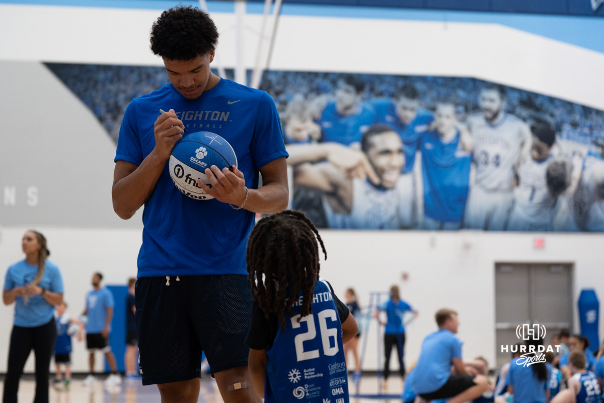 Creighton Bluejay Jasen Green signs a ball during their yearly abilities camp on June 5, 2026, in Omaha, Nebraska. Photo by Brandon Tiedemann.