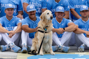North Carolina Tar Heel Remington the dog sat in on the team photo during the CWS media day on Thursday, June 11, 2026, in Omaha, Neb. Photo by John S. Peterson.
