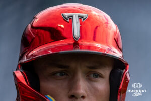 Troy Trojan with a red chrome batting helmat while at batting practice during the CWS media day on Thursday, June 11, 2026, in Omaha, Neb. Photo by John S. Peterson.